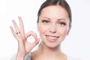 Person making an 'okay' gesture.