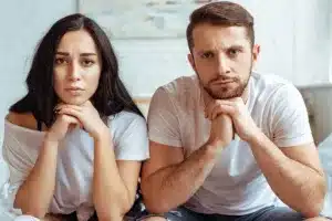 Two people sitting with blurred faces