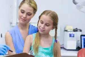 Child at dental appointment with parent