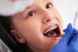 Child with braces at dentist appointment