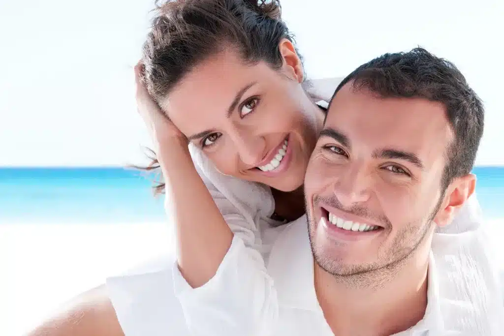 Couple enjoying beach day together.