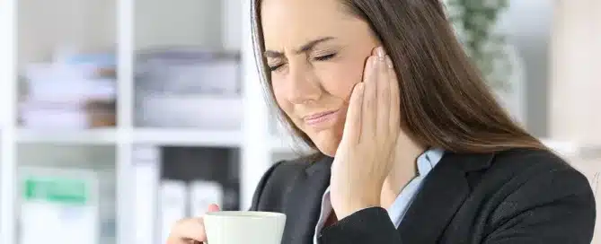 Person holding a cup in office