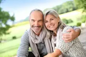 Happy couple smiling outdoors together