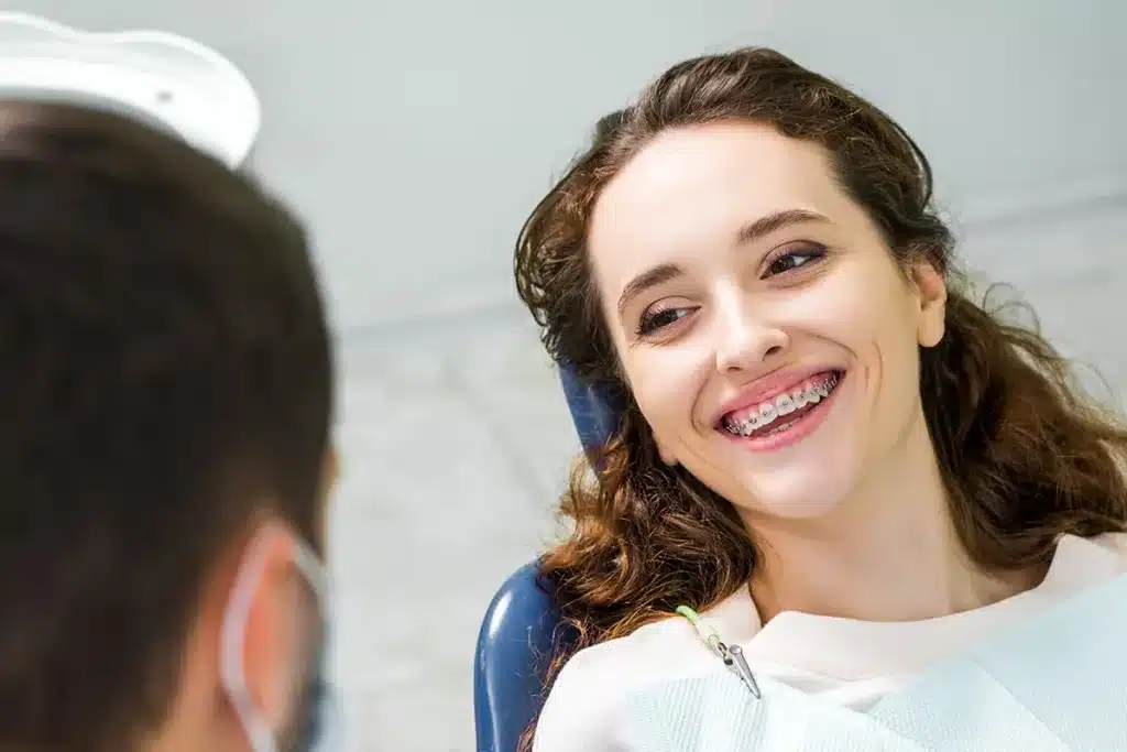 Patient in dental chair, blurred face