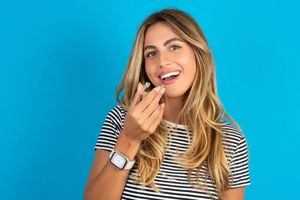 Person with striped shirt and watch