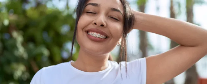 Person posing outdoors with blurred face