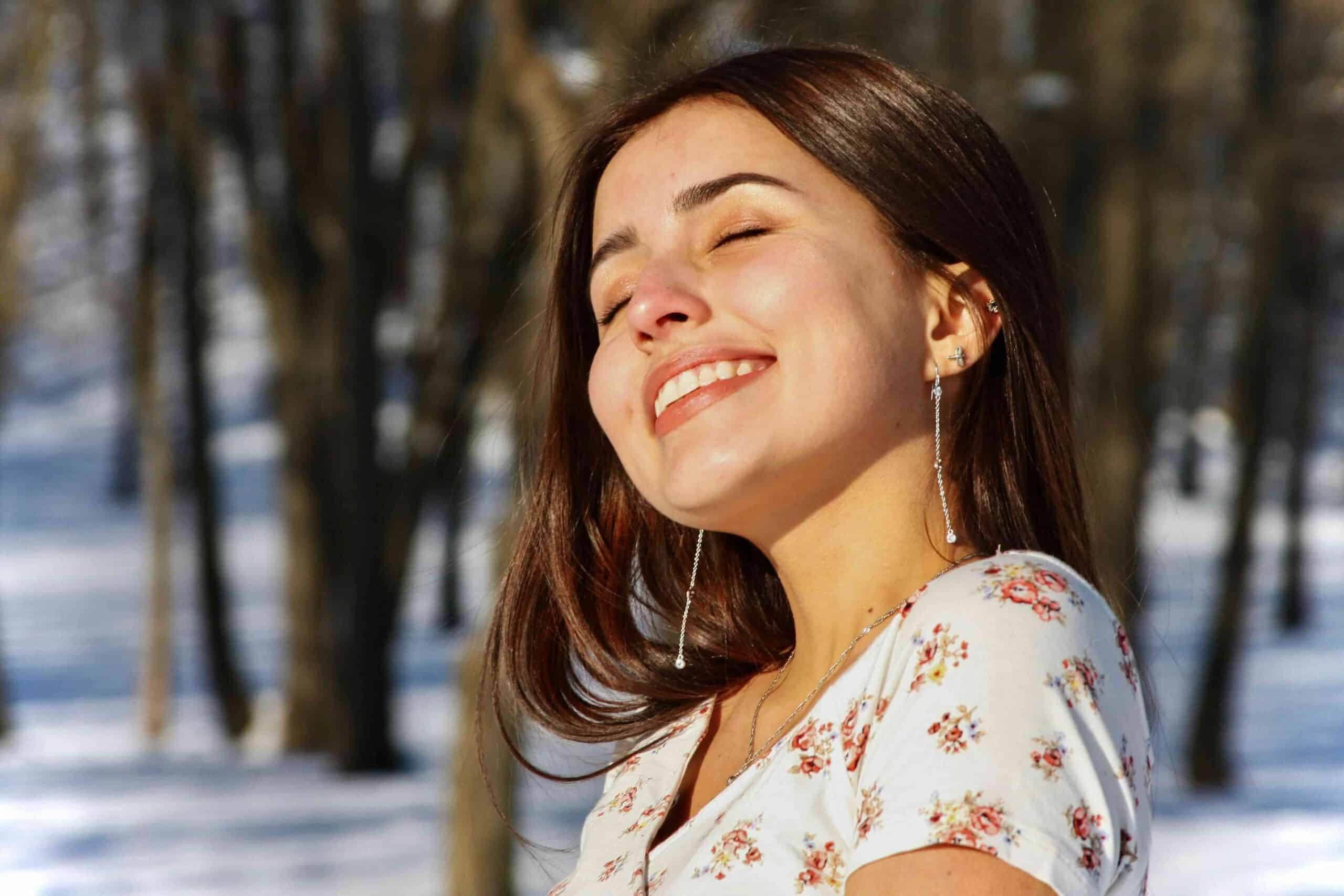 Will Shaving Teeth For Braces Help? What You Need to Know 6 woman smiling with sun in face