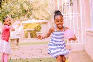 little girl running around park in century city