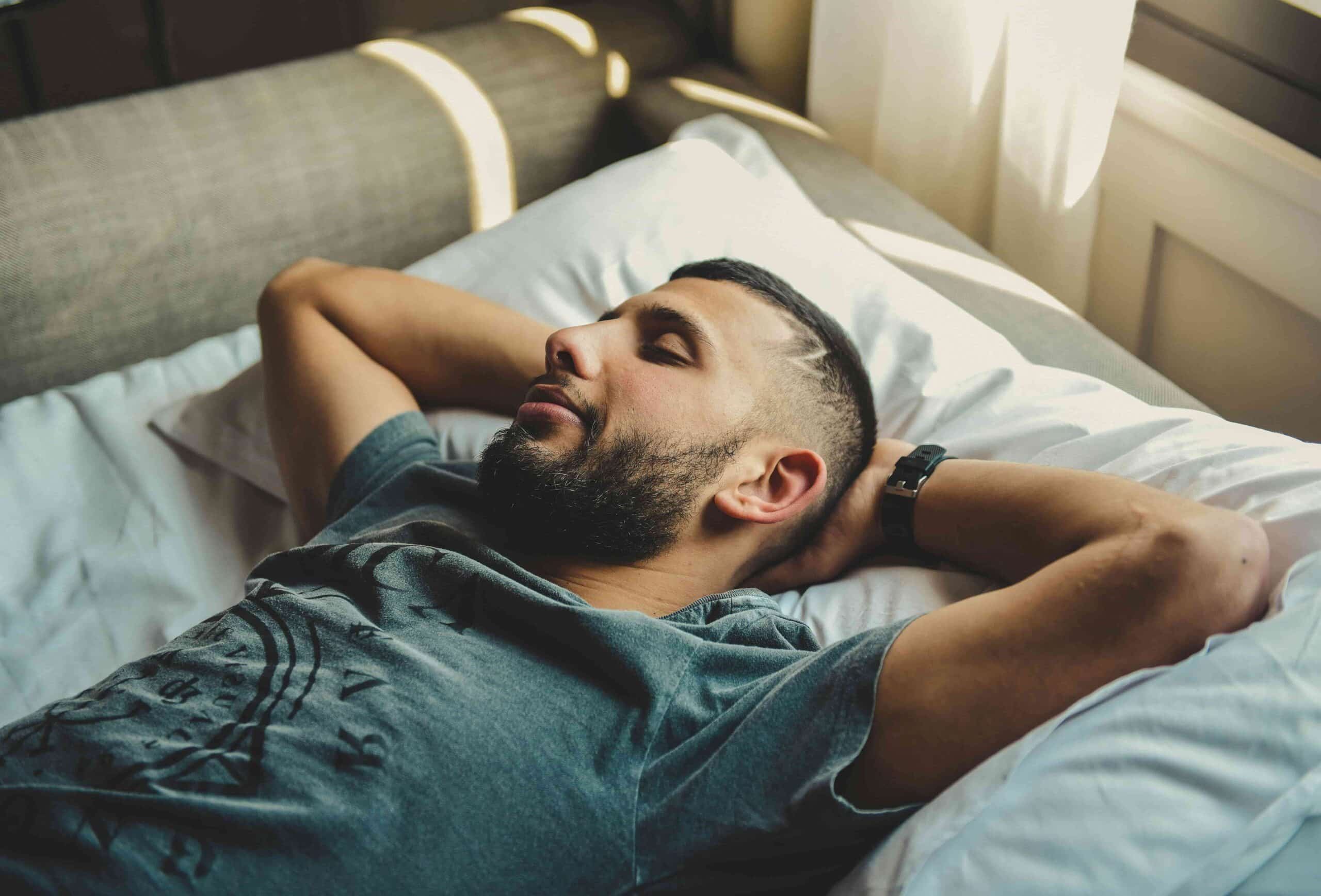 man snoring in bed